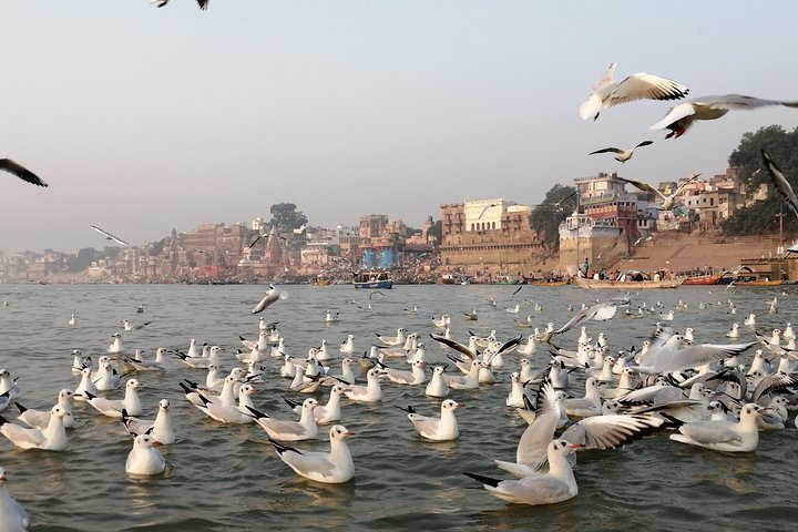 Traditional Indian dancers performing near Ganges River in Varanasi at sunset