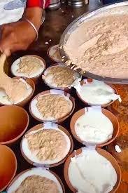 Thick Banarasi lassi in kulhad with saffron and rabri – a cooling best street food in Varanasi drink