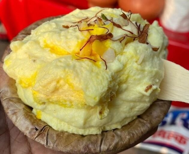 “Local Varanasi dessert Malao with saffron and pistachio garnish”